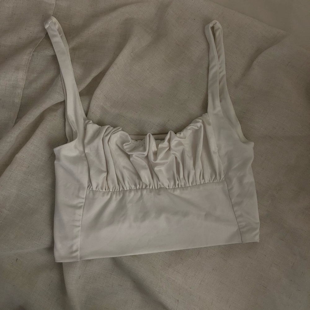 white silky bustier like top
